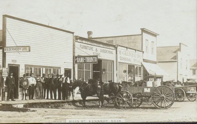 Main Street, Kennedy, with horse-drawn wagons and storefronts
